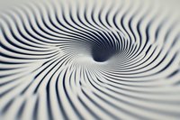 Hypnotic spiral pattern in black and white creates optical illusion effect with swirling lines converging into dark center, abstract background for creative designs.