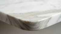 Elegant marble countertop corner showcasing natural stone veining and smooth polished surface for luxury kitchen and bathroom interior design projects.