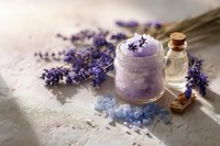 Homemade lavender body scrub with essential oil and bath salt for natural skincare and aromatherapy spa treatment.