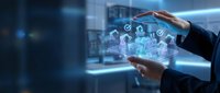 Businessman hands protecting holographic digital icons representing cybersecurity, data protection and technology solutions in modern office environment.