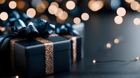 Luxury black gift boxes with glittering gold ribbons and bows arranged on dark surface with warm bokeh lights, suitable for holiday, celebration and festive marketing materials.
