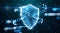 Glowing digital shield with hexagonal pattern and circular energy rings on dark blue technology background for cybersecurity and data protection concepts.