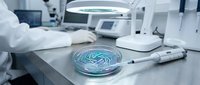 Laboratory scientist examining bacterial culture in petri dish under magnifying lamp for microbiological research and medical testing analysis.