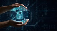 Hands protecting glowing padlock symbol representing cybersecurity, data protection, and digital safety in technology environment for business security concepts.