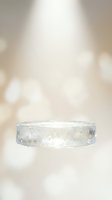Clear glass cylinder podium on soft beige bokeh background for product display and presentation purposes.