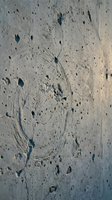 Weathered concrete wall surface with natural cracks, holes and aging texture for industrial design projects and urban architecture backgrounds.