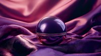 Mysterious dark glass sphere on luxurious purple silk fabric with dramatic lighting and reflective surface creates mystical atmosphere for fortune telling concepts.