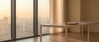 Empty modern office or apartment interior with floor-to-ceiling windows overlooking city skyline at sunset, minimalist wooden desk, and warm natural light for corporate or residential design projects.
