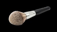 Fluffy makeup brush with natural bristles and black handle isolated on transparent background, ready for beauty design projects and print-on-demand products.