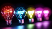 Glowing light bulbs in vibrant neon colors of red, blue, yellow and pink arranged in row against dark background create modern creative concept of innovation and ideas.