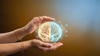 Hand holding glowing brain with neural connections, representing artificial intelligence, creativity, innovation, and digital technology concepts for business and science applications.