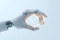 White robotic hand reaching out against light background, glowing with warm illumination between mechanical fingers, showcasing advanced technology and innovation.