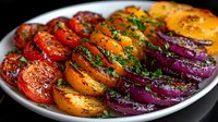 Grilled colorful tomatoes, yellow and red bell peppers, and purple onion rings garnished with fresh herbs on white plate, macro food photography.