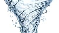 Water tornado swirling with dynamic motion and splashing droplets isolated on white background for creative design projects.