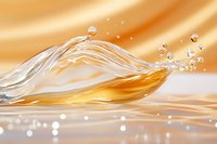 Dynamic liquid wave splashing against golden background, creating transparent ripples and droplets with soft bokeh effect and smooth flowing motion.