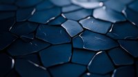 Dark blue cracked surface with geometric pattern of broken pieces creating abstract mosaic texture, dramatic lighting highlights edges and fractures.