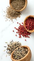 Aromatic spices in wooden bowls on white background. Cumin seeds, red peppercorns and fennel seeds scattered around rustic containers for culinary cooking.