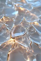 Cracked glass surface with golden light shining through fractures creates dramatic abstract pattern. Macro photography reveals intricate details of broken material.