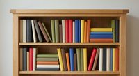 Wooden bookshelf with colorful books arranged on two shelves, home library organization and storage solution for reading materials and literature collection.