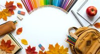 Colorful school supplies arranged in circle with autumn leaves, notebooks, pencils, backpack and apple creating back to school flat lay composition.