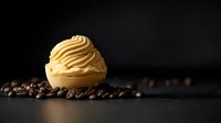 Creamy scoop of coffee-flavored ice cream with swirled peaks surrounded by scattered roasted coffee beans on dark background, dramatic food photography.