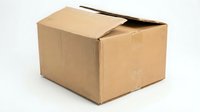 Open brown cardboard shipping box with flaps partially opened, isolated on white background for packaging and delivery concepts.