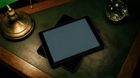 Digital tablet with blank screen on vintage wooden desk with brass lamp and glass ashtray in moody lighting for business presentations and creative work.