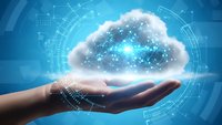 Hand holding glowing cloud with network connections and digital interface elements representing cloud computing technology and data storage solutions.