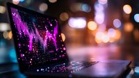 Glowing pink financial chart on laptop screen with bokeh background lights, modern trading workspace setup showing market analysis data visualization.