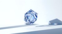 Blue crystal geometric shape with faceted surfaces casting shadows on white surface for luxury jewelry design and modern decor applications.