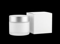 Frosted cosmetic cream jar with silver lid and white box mockup, isolated on transparent background, ready for branding, packaging design, and print on demand.
