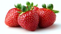 Fresh ripe strawberries with green leaves isolated on white background, showing vibrant red color and natural texture. For food packaging and advertising.