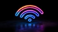 Glowing neon wifi symbol with gradient color from red to blue floating in dark space with reflection on glossy surface, modern technology concept.