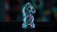 Transparent glass chess knight piece with colorful light reflections on dark surface for strategic gaming and business concepts.