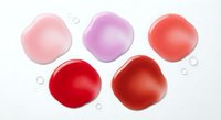 Colorful rose petals in pink purple and red tones isolated on white background for romantic design projects and floral decorations.