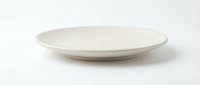 Empty white ceramic plate isolated on white background for food presentation and kitchen design projects.