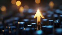 Glowing upward arrow rises above keyboard keys with blurred bokeh lights background, symbolizing growth, success and technological advancement.