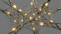 Illuminated wire star decoration with warm LED lights creating festive ambiance for holiday celebrations and seasonal home decor projects.