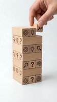 Hand placing wooden block with lightbulb icon on stack representing creative problem solving and innovation in business strategy development.