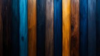 Vertical wooden planks in contrasting blue and amber tones create dramatic striped pattern with rich texture and shadowed effect, suitable for modern interior design background.
