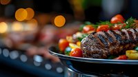 Juicy grilled beef steak with fresh cherry tomatoes and herbs on black plate against blurred warm bokeh background, restaurant quality food presentation.