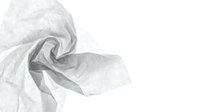 Crumpled white translucent fabric with soft folds and wrinkles isolated on white background, suitable for design overlays, textures, and creative projects.