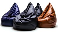 Four modern bean bag chairs in navy blue, gray, black and brown leather arranged in row on white background, isolated furniture for interior design.