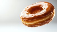 Freshly baked glazed donut floating on white background, golden-brown dough with smooth shiny coating, macro food photography for bakery marketing.