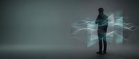 Businessman in dark suit interacting with digital holographic data visualization and flowing light waves in modern tech environment for business technology concepts.