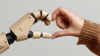 Human hand and robotic prosthetic hand forming heart shape together, symbolizing connection between technology and humanity.