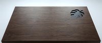 Wooden desk surface with palm leaf cutout detail, isolated on white background for design mockups, product displays, and interior styling projects.