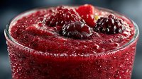 Fresh berry smoothie with mixed berries and ice in glass, healthy drink for breakfast or post-workout nutrition and wellness lifestyle.