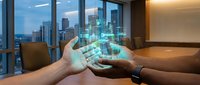 Hands holding holographic digital city buildings and data visualization in modern office with skyline view, representing smart city technology, urban development, and business innovation.