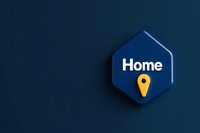 Minimalist hexagonal sign with home text and yellow location pin on deep navy blue background, modern design concept for real estate and navigation.